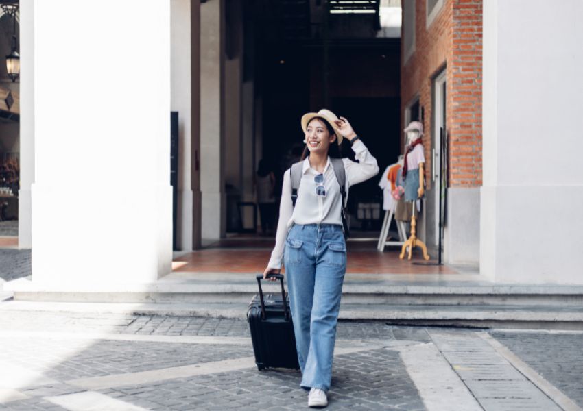 person-with-case-walking-across-road