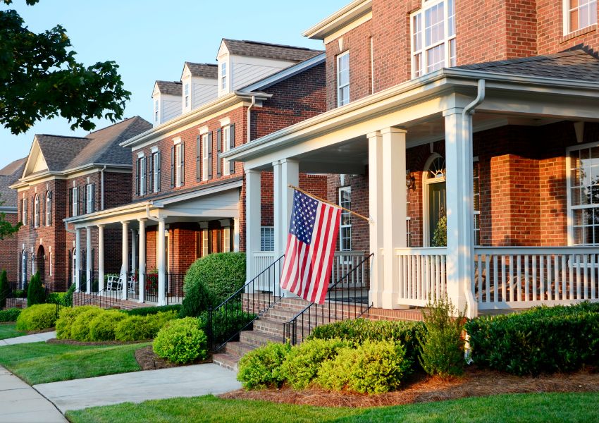 row-of-houses-with-pillars-and-flag